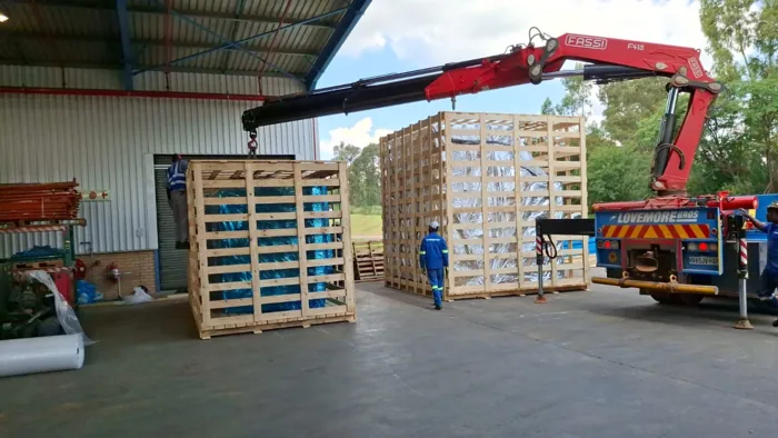 Crated equipment during crane loading